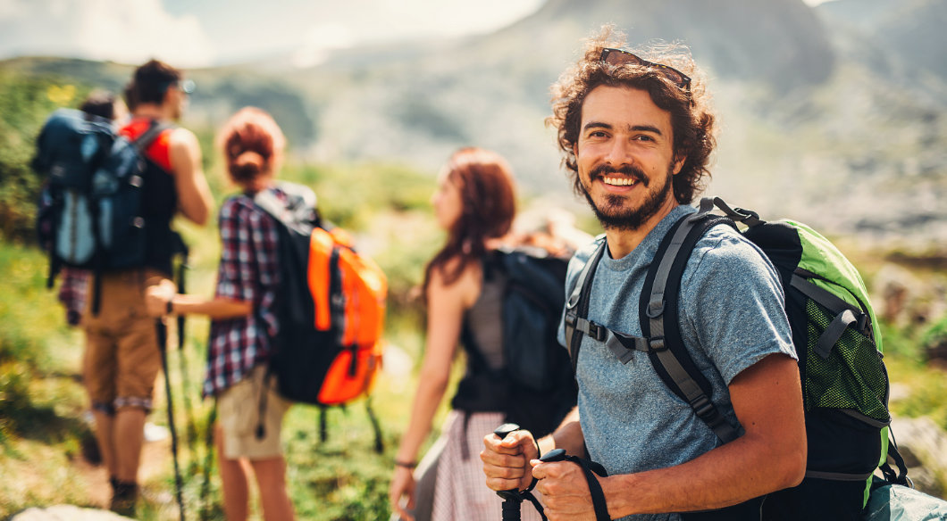 man hiking with friends