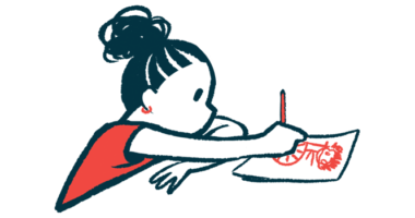 A child is seen drawing a picture while seated at a table.
