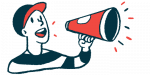 A person uses a megaphone to make an announcement.