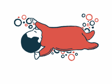 An infant lies on his back asleep.