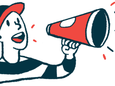 A person wearing a baseball cap speaks into a megaphone.