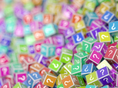 A bunch of dice with questions marks on them