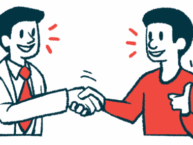 A doctor and patient shake hands while talking with one another.