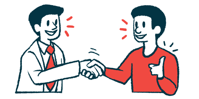 A doctor and patient shake hands while talking with one another.