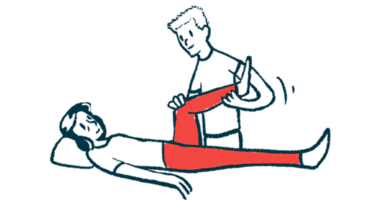 A physical therapist helps a patient move his leg.