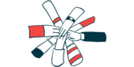 A collection of hands come together in a circle to illustrate a collaborative effort.