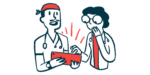 Two doctors look at a tablet computer.