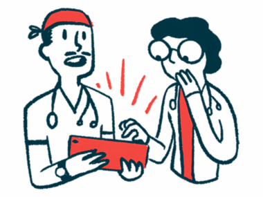 Two doctors look with surprise at data on a tablet computer.