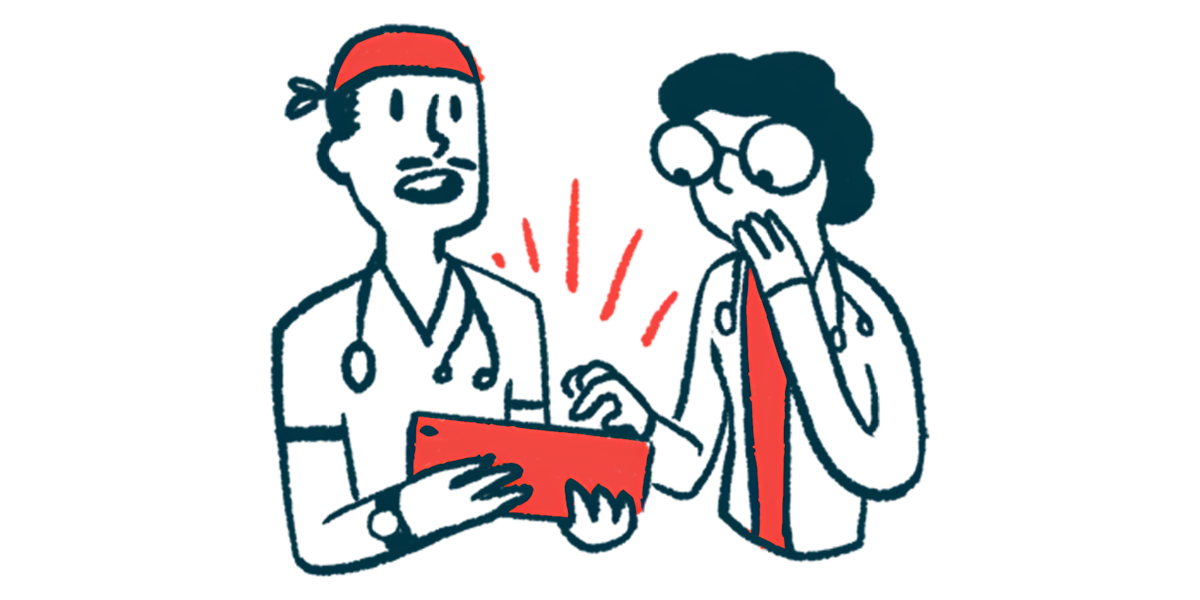 Two doctors look at a tablet computer.