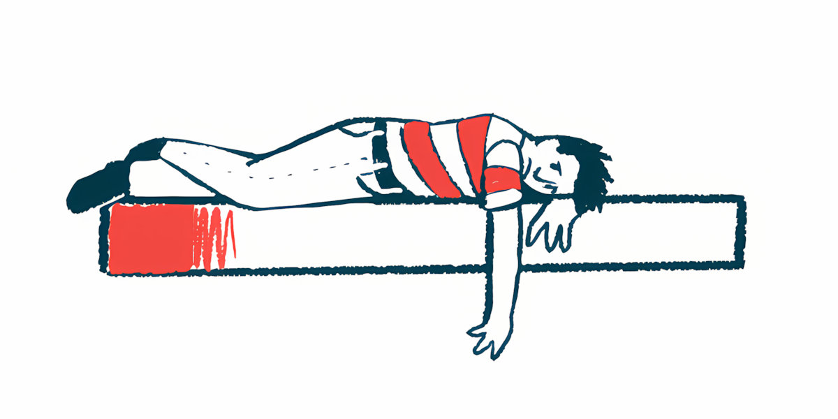 A frowning person lies on a bed with one arm hanging over the edge.