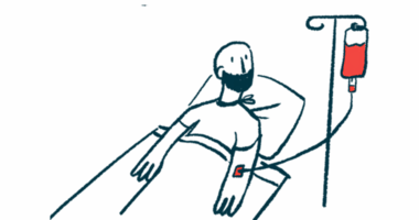 A man in a hospital bed looks up at his IV bag.