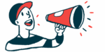 A man shouts into a bullhorn.