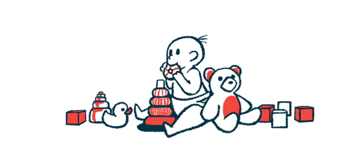 A baby surrounded by toys is mouthing one.
