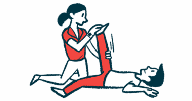 A physical therapist raises and stretches the leg of a patient lying on their back.