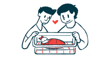 Two adults with their heads together look at a newborn in a hospital bassinet.
